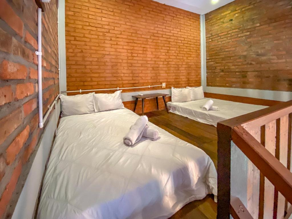 Postel nebo postele na pokoji v ubytování Griya Gribig Guest House Mitra RedDoorz