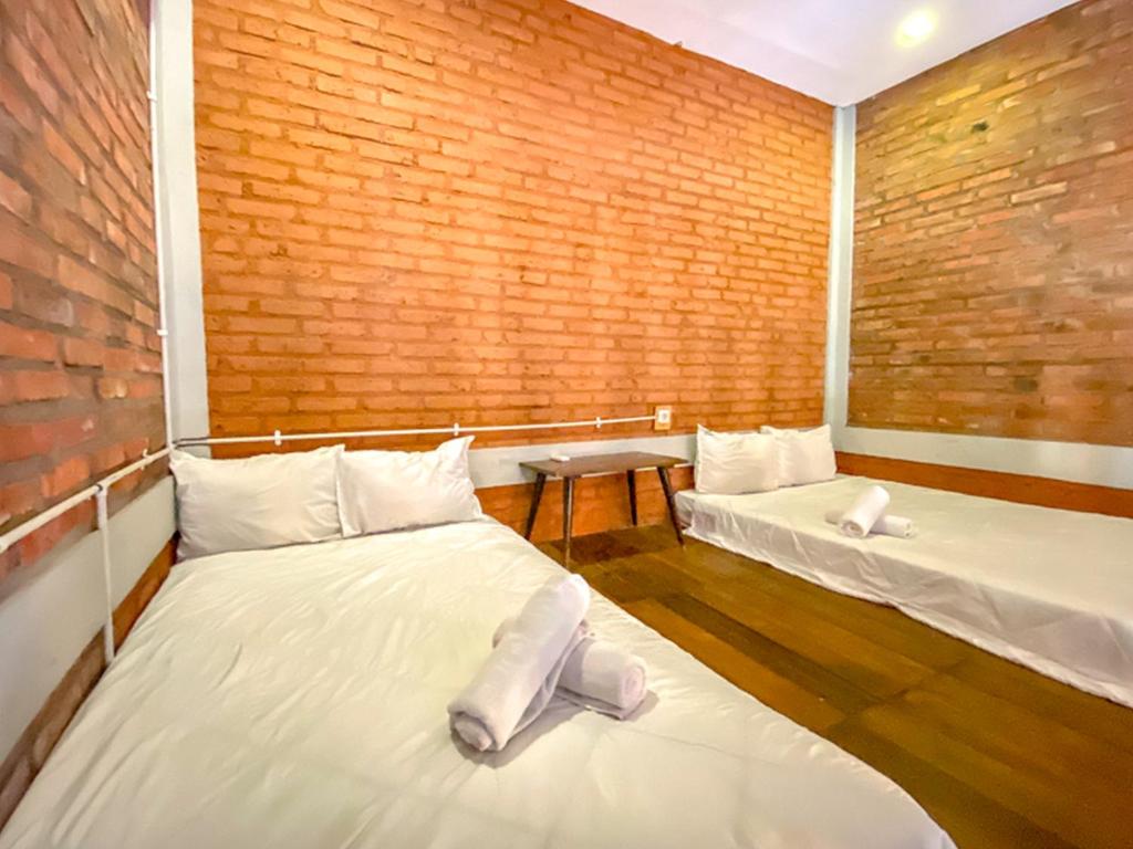 Postel nebo postele na pokoji v ubytování Griya Gribig Guest House Mitra RedDoorz