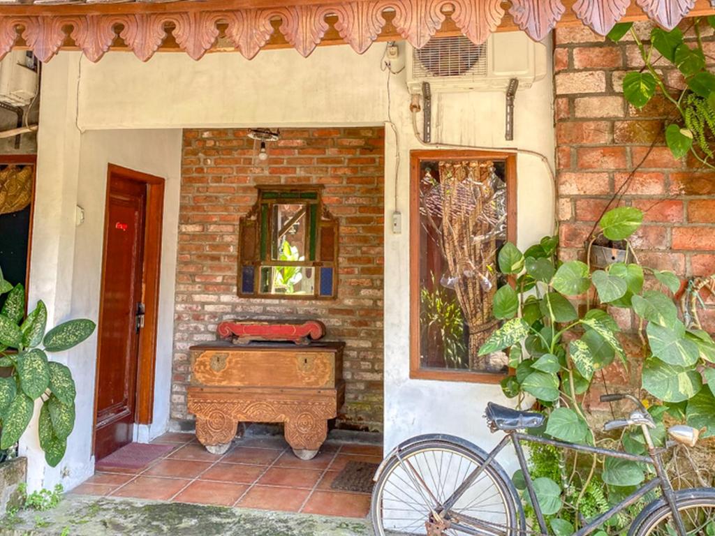 Fotografie z fotogalerie ubytování Griya Gribig Guest House Mitra RedDoorz v destinaci Malang