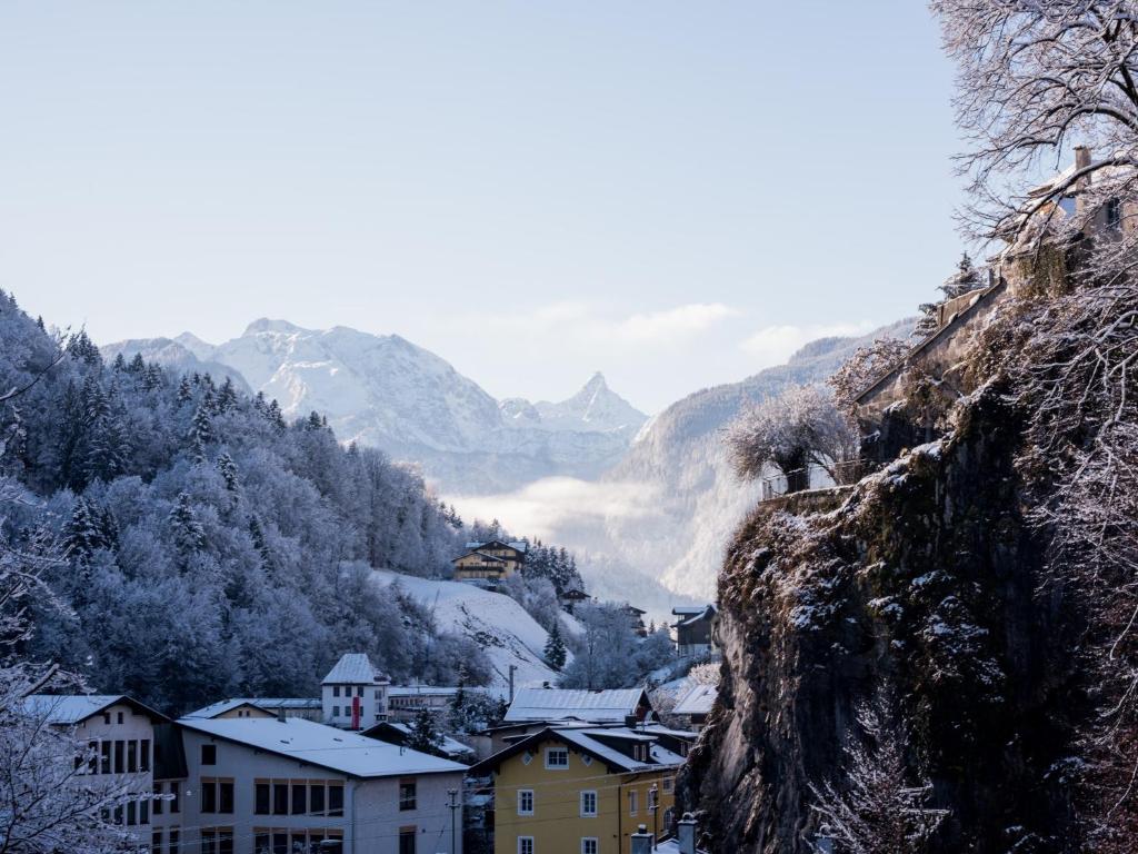 a town in a valley with snow covered mountains at Ferienwohnung Tichy in Berchtesgaden