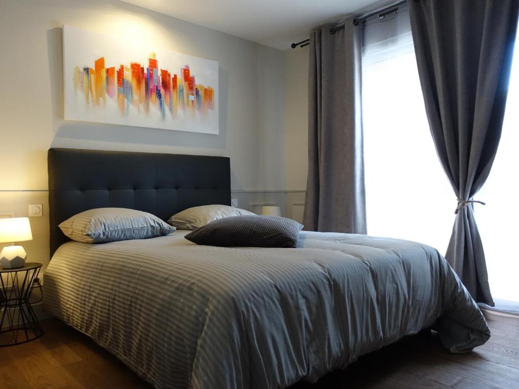 En eller flere senge i et værelse på Les Prémontrés