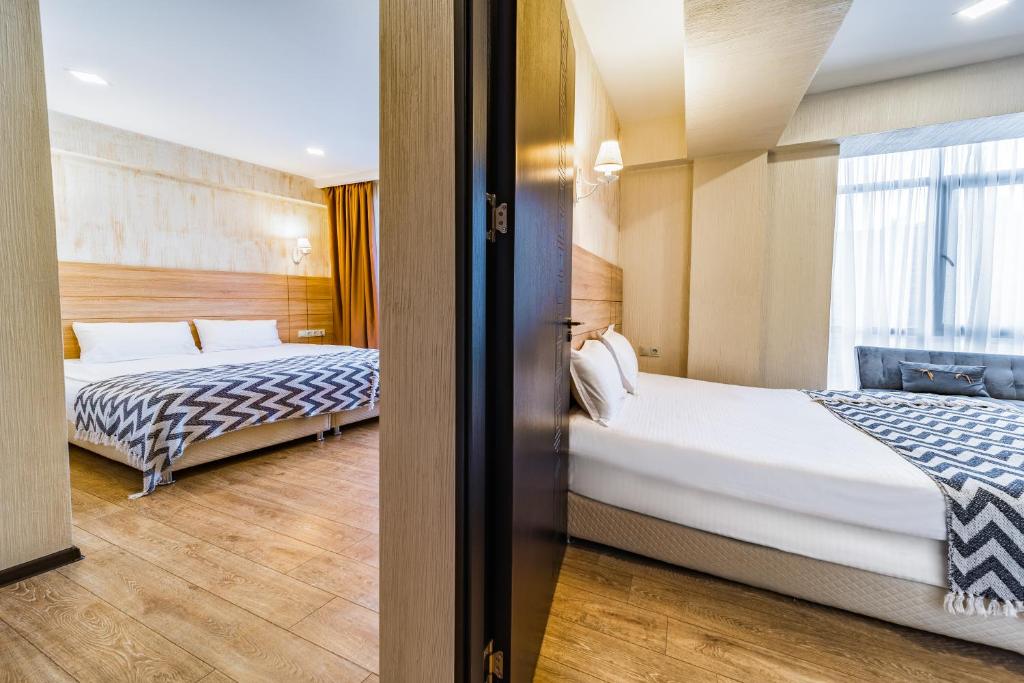 Postel nebo postele na pokoji v ubytování BM Plaza