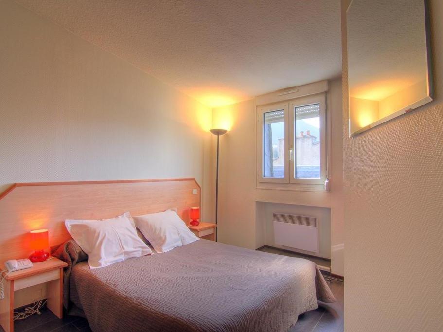 Postel nebo postele na pokoji v ubytování Logis Hôtel Restaurant Le Drakkar