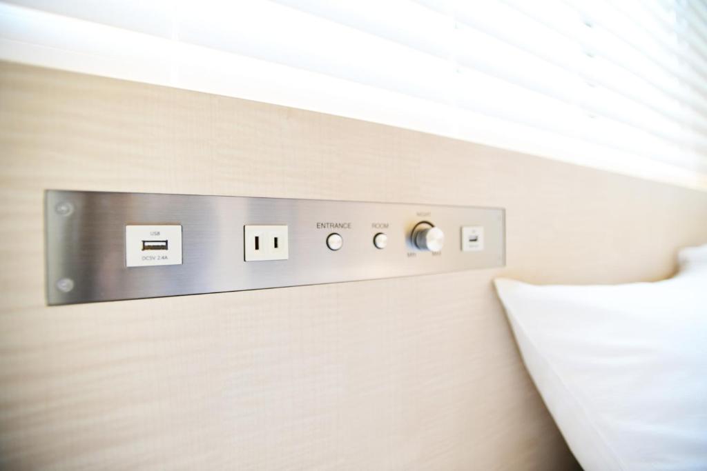 Postel nebo postele na pokoji v ubytování IAM HOTEL