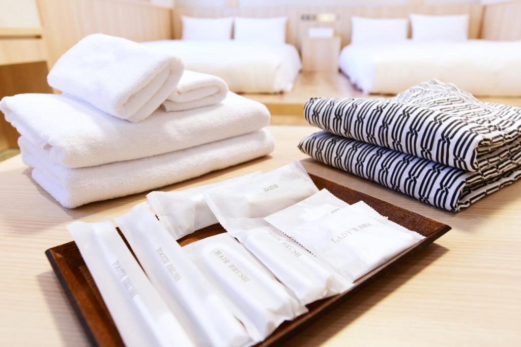 Postel nebo postele na pokoji v ubytování IAM HOTEL