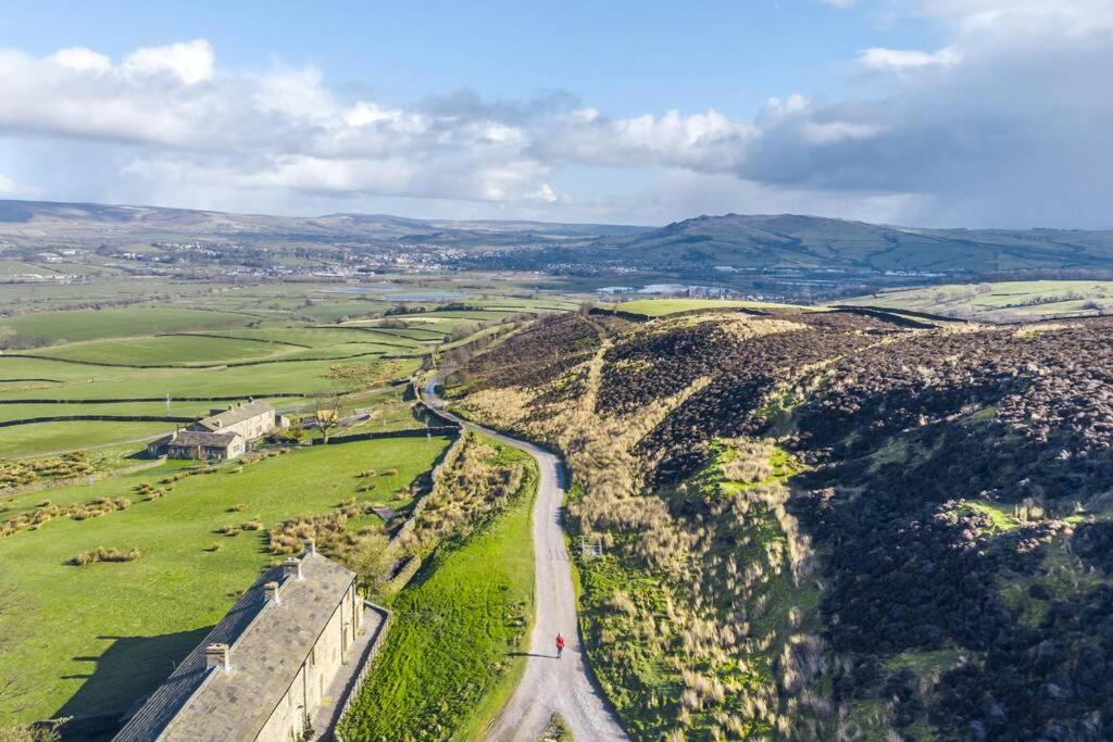 an aerial view of a road on a hill at Higher Scarcliffe at Broughton Sanctuary in Skipton