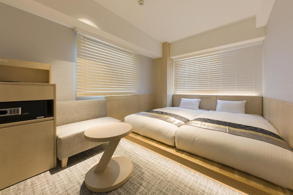 Postel nebo postele na pokoji v ubytování IAM HOTEL