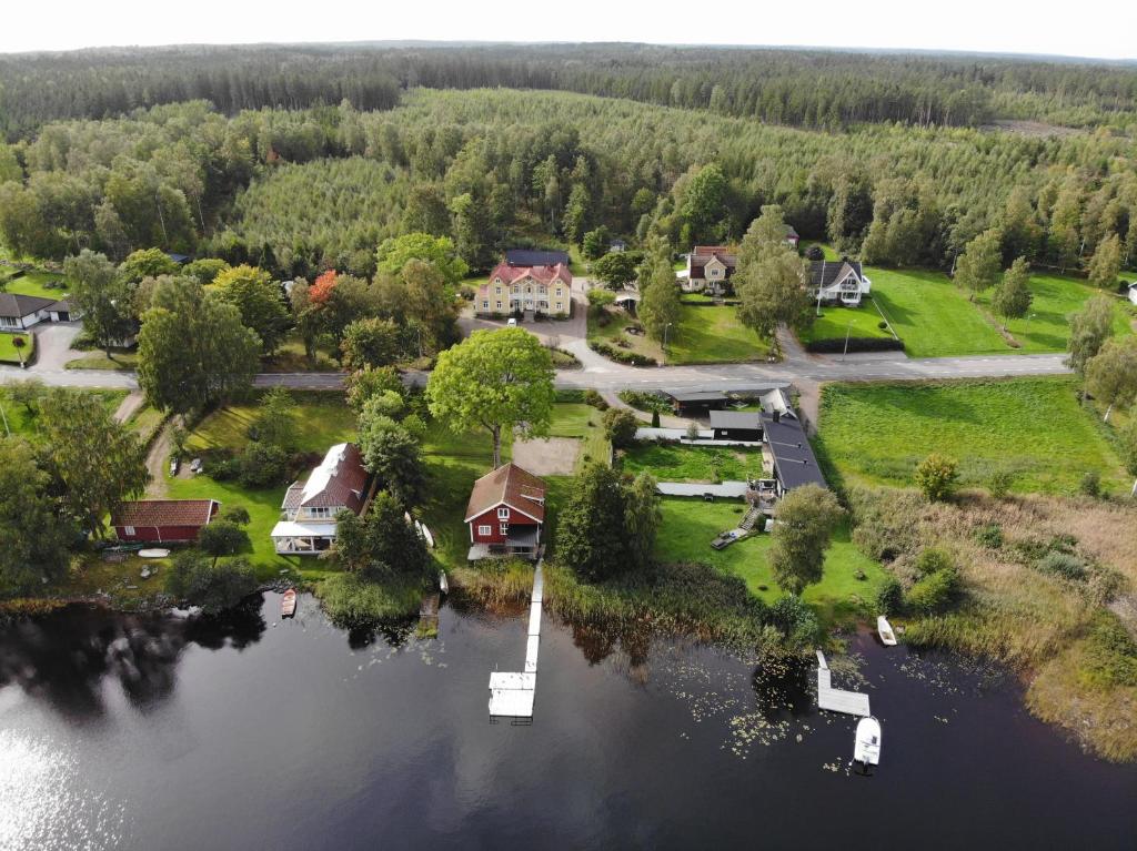 an aerial view of a house on an island in the water at Alebo Pensionat in Unnaryd