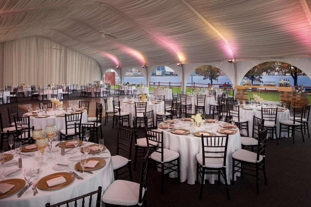 a tent set up for a wedding with tables and chairs at Hyatt Regency Boston Harbor in Boston