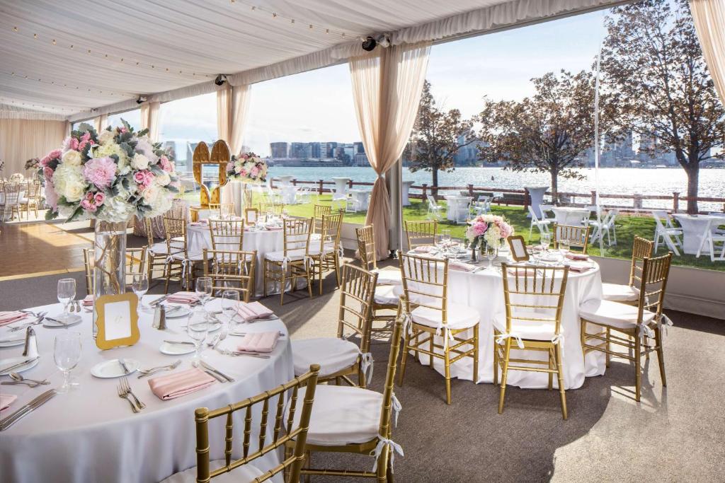 a wedding reception in a tent with tables and chairs at Hyatt Regency Boston Harbor in Boston