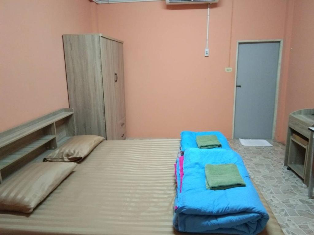 Postel nebo postele na pokoji v ubytování E2S Place