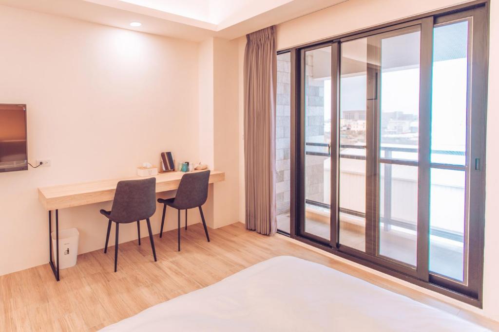 Postel nebo postele na pokoji v ubytování The Pai Hotel