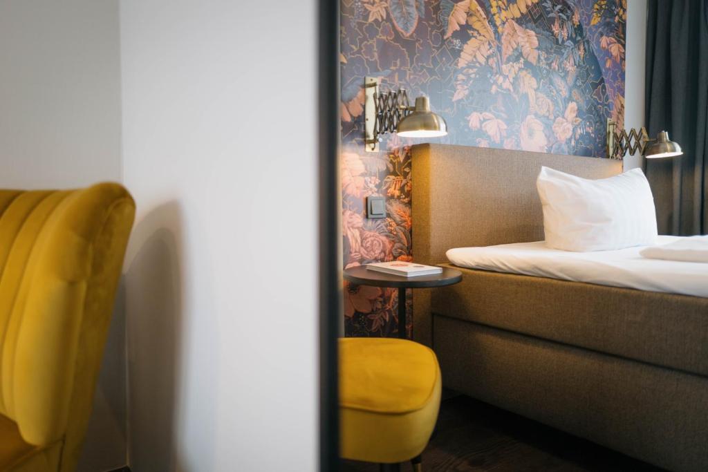 Postel nebo postele na pokoji v ubytování Hotel Stümpelstal