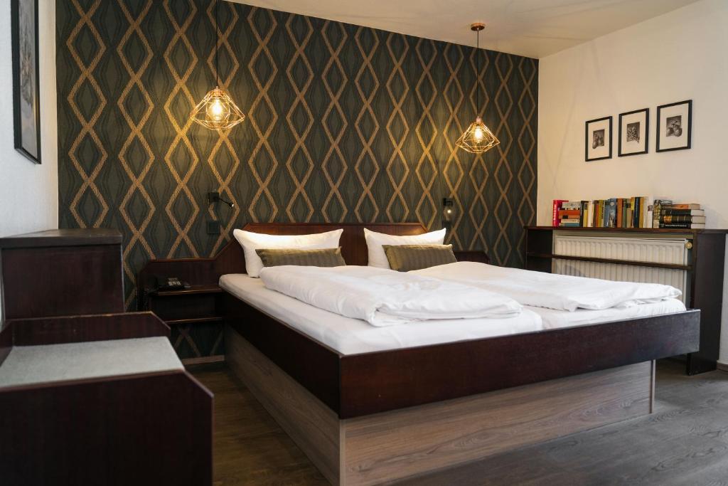 Postel nebo postele na pokoji v ubytování Hotel Stümpelstal