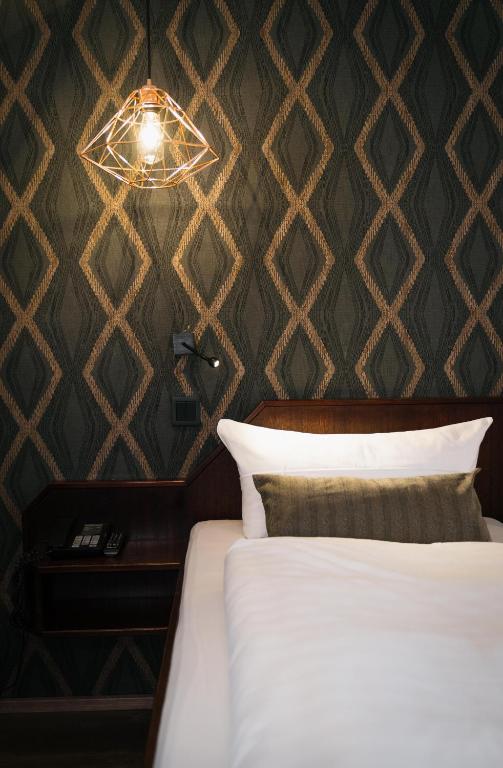 Postel nebo postele na pokoji v ubytování Hotel Stümpelstal