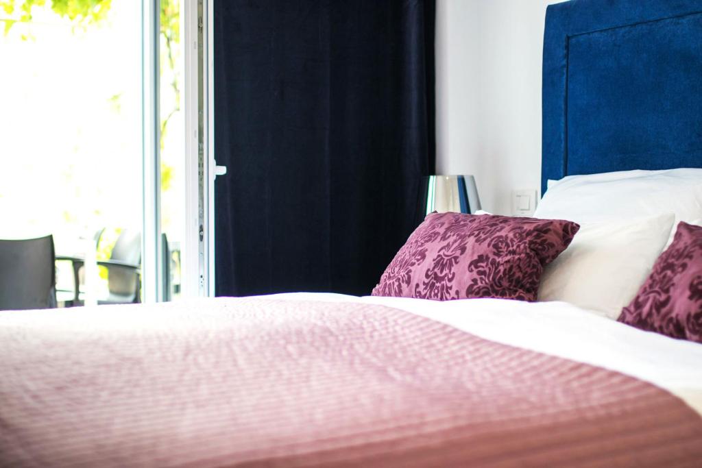 Postel nebo postele na pokoji v ubytování Marina di Portapisana Luxury private villa