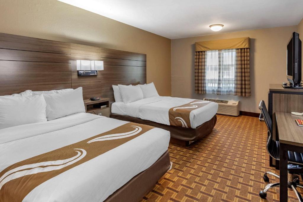 Voodi või voodid majutusasutuse Hotel Inn Santa Fe toas