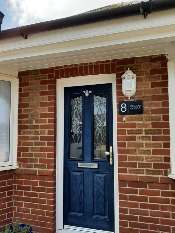 a blue front door of a brick house at Home from Home Stay Margate in Margate