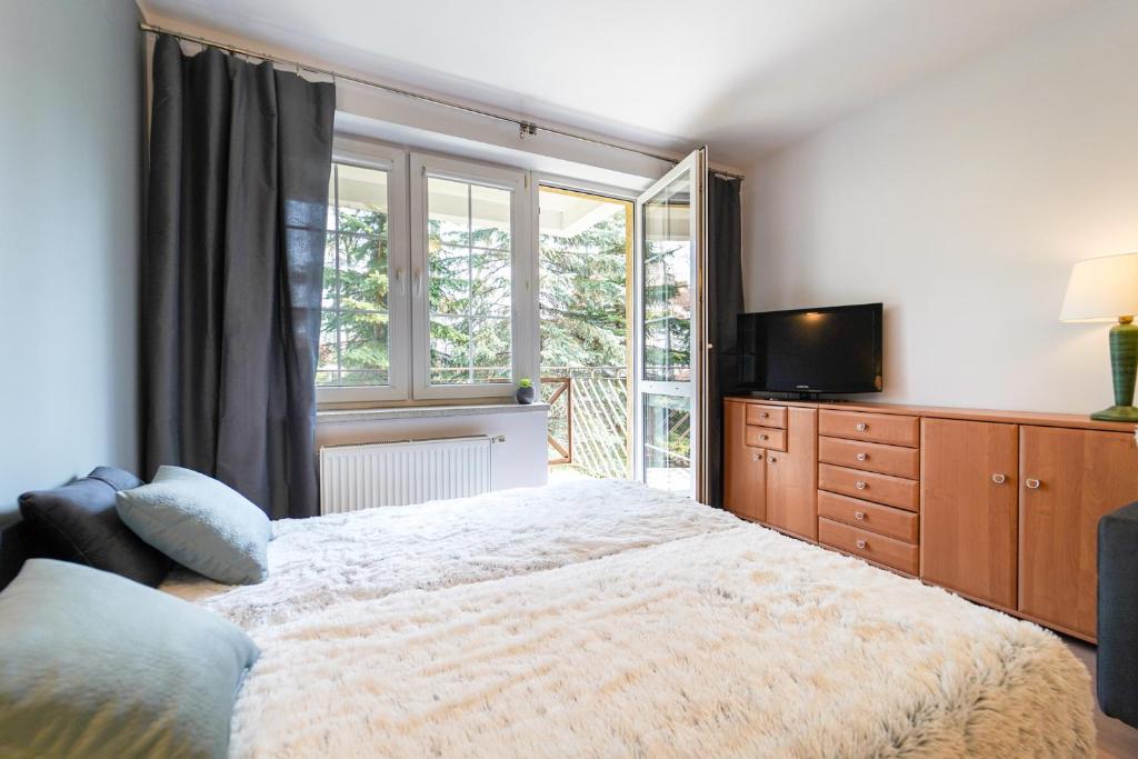 Posteľ alebo postele v izbe v ubytovaní Flatbook Apartamenty - Krynica Morska Żeromskiego