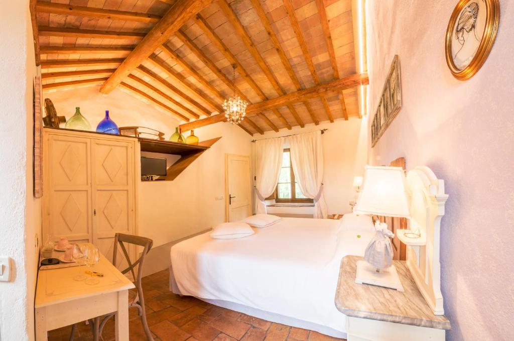 Postel nebo postele na pokoji v ubytování Agriturismo Il Segreto di Pietrafitta