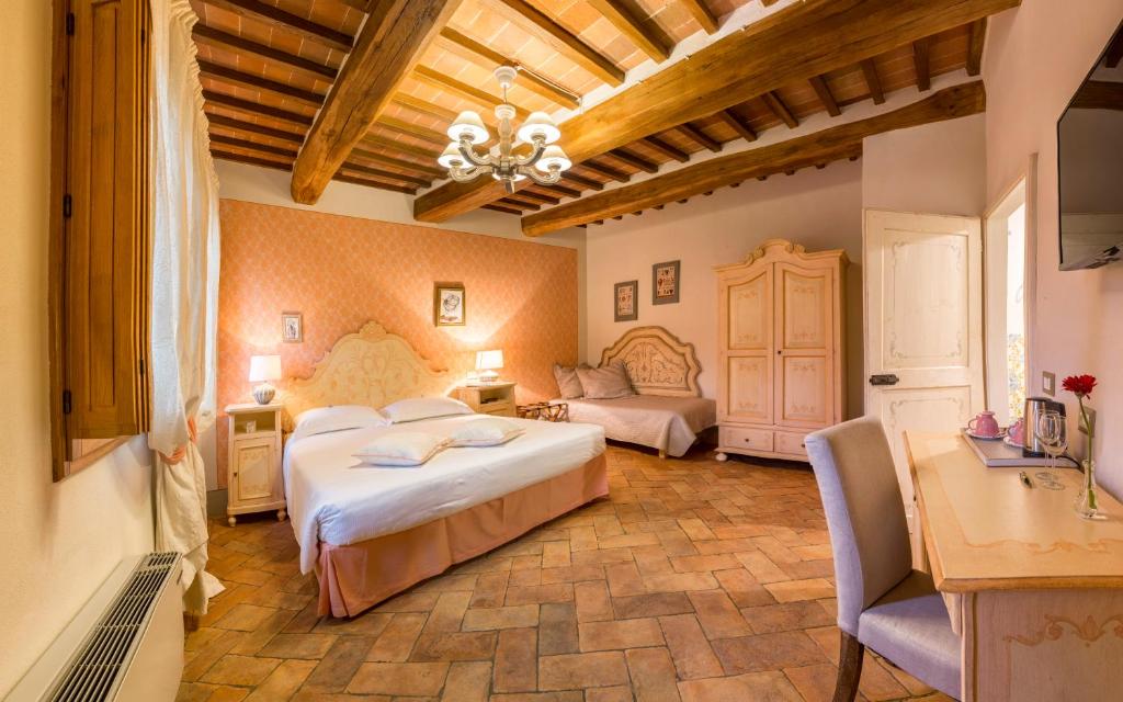 Postel nebo postele na pokoji v ubytování Agriturismo Il Segreto di Pietrafitta