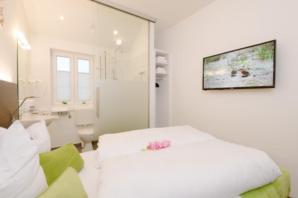 Postel nebo postele na pokoji v ubytování Velden24 - create your own stay