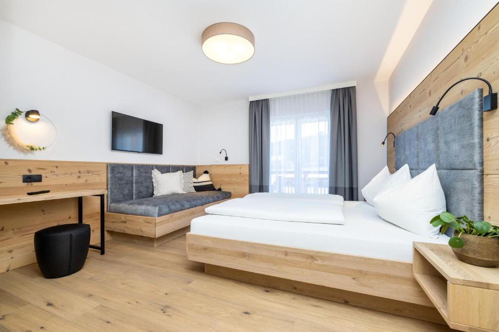 Postel nebo postele na pokoji v ubytování Aparthotel Jägerheim