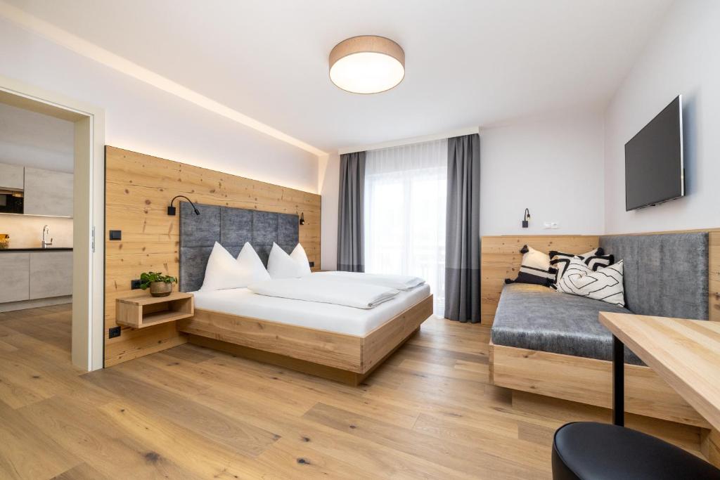 Postel nebo postele na pokoji v ubytování Aparthotel Jägerheim