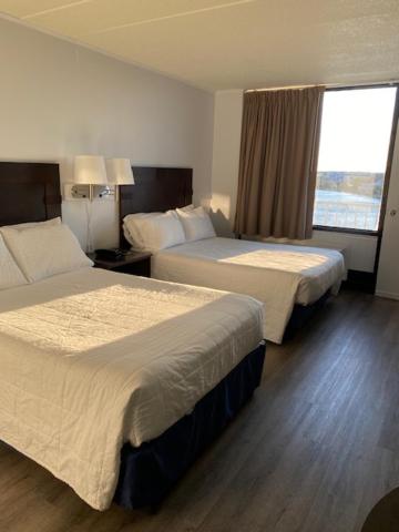 Postel nebo postele na pokoji v ubytování Fenwick Islander Motel