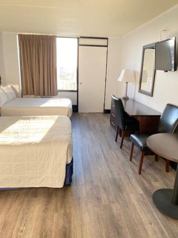 Postel nebo postele na pokoji v ubytování Fenwick Islander Motel
