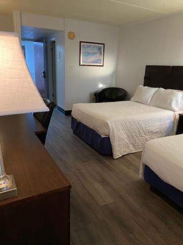 Postel nebo postele na pokoji v ubytování Fenwick Islander Motel