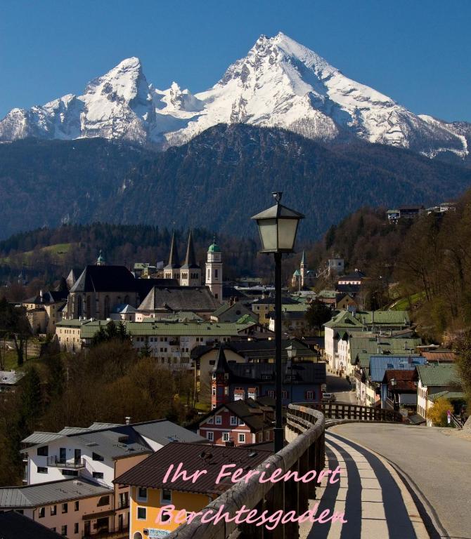 a view of a city with a snow covered mountain at Haus Schmidt in Berchtesgaden