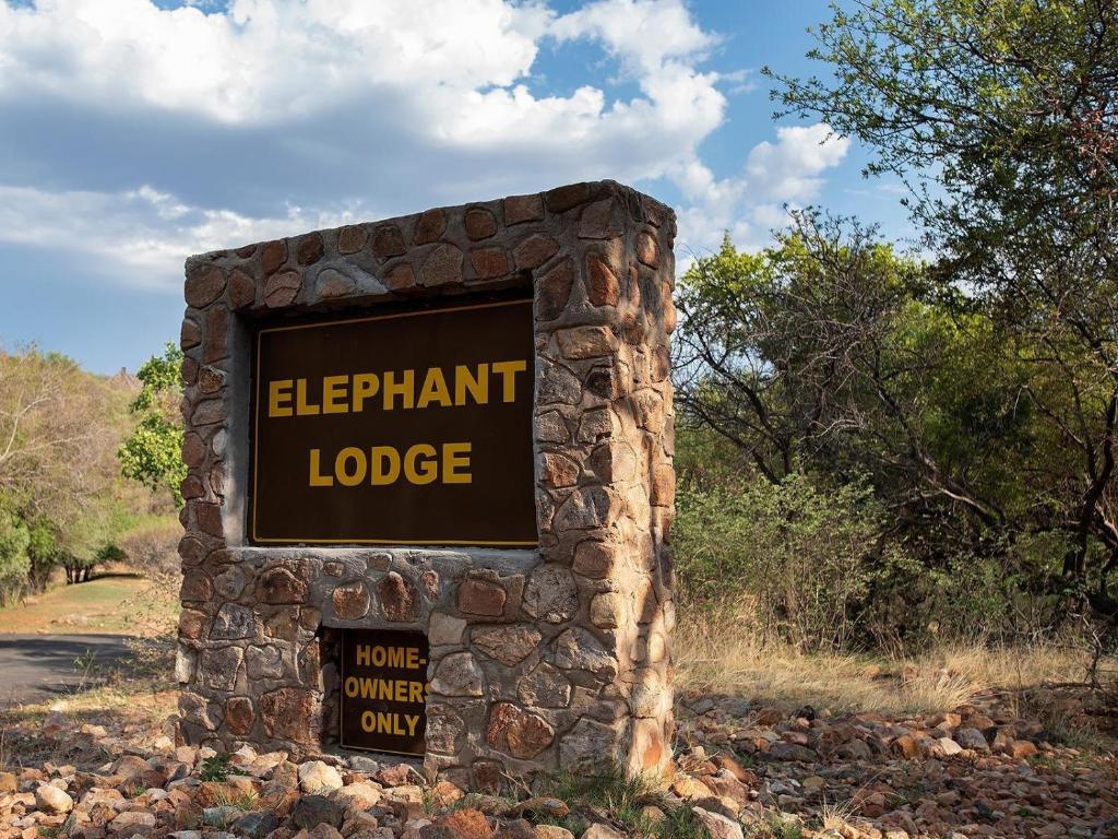 a sign for a elephant lodge in a field at Mabalingwe Elephant Lodge 267-7 & 267-8 in Mabula