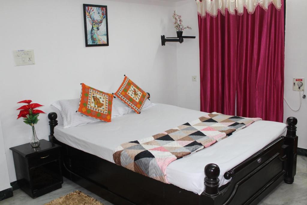 Postel nebo postele na pokoji v ubytování FriendlyStay at Madanandapuram
