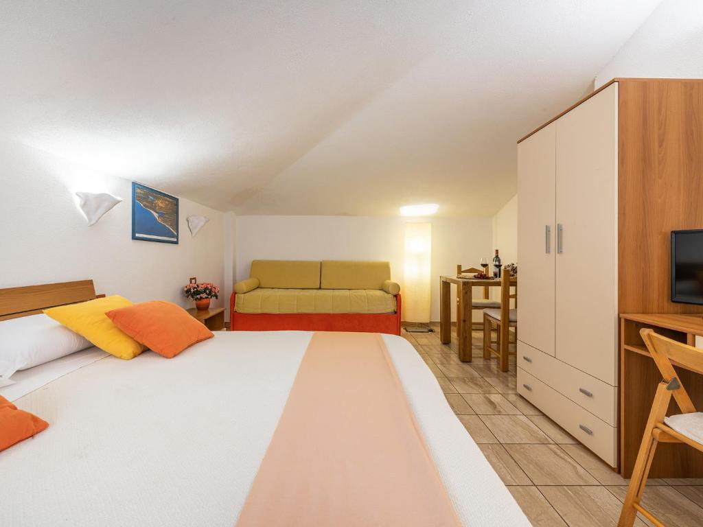 Postel nebo postele na pokoji v ubytování Bed and Breakfast Dorgali