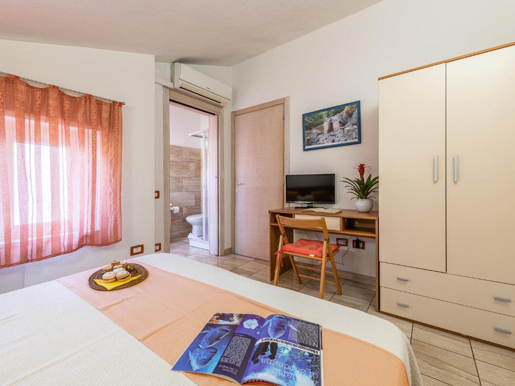 TV a/nebo společenská místnost v ubytování Bed and Breakfast Dorgali