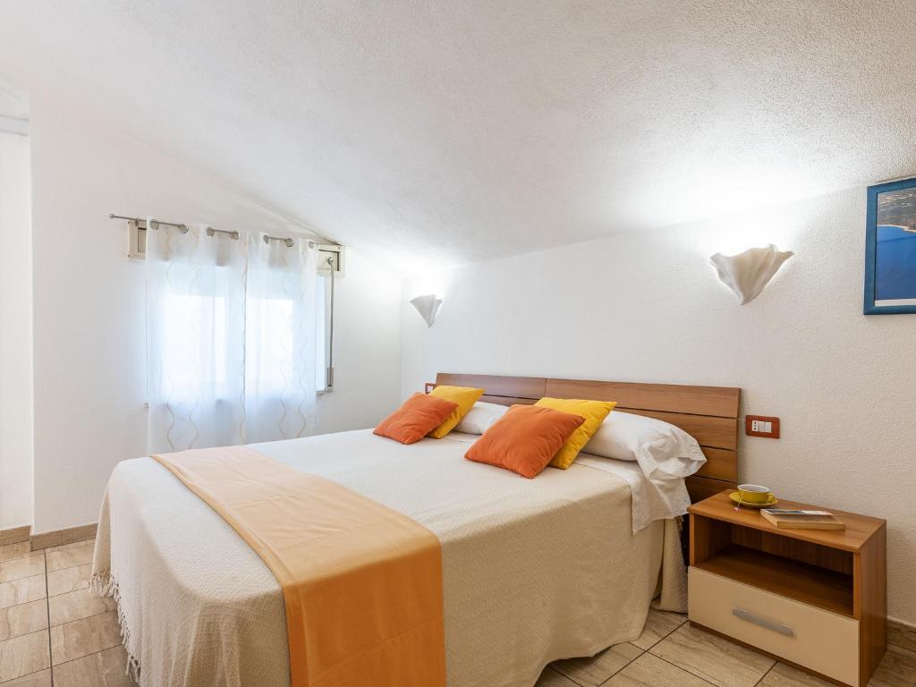 Postel nebo postele na pokoji v ubytování Bed and Breakfast Dorgali