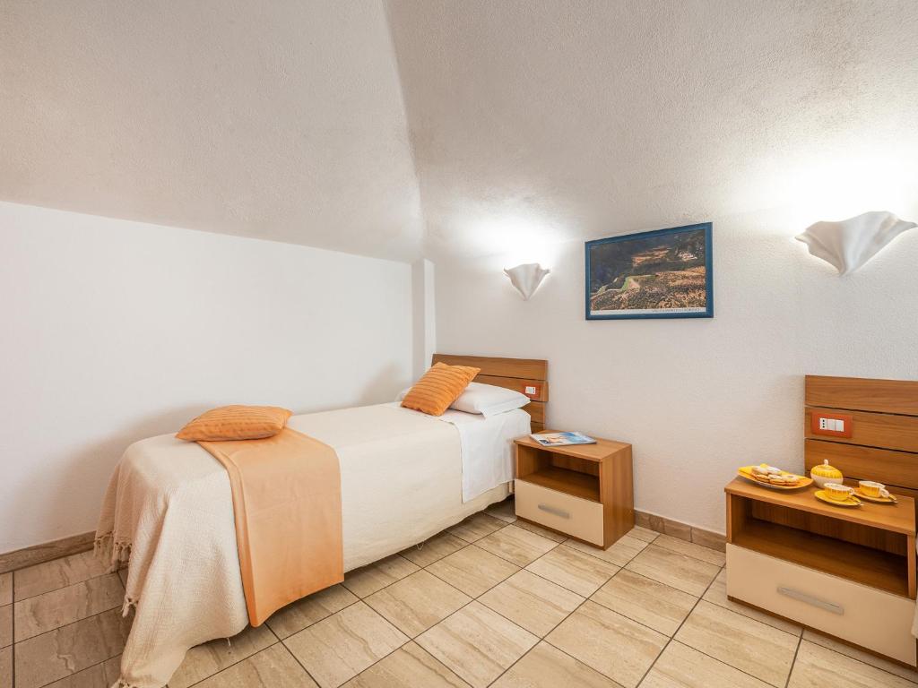 Postel nebo postele na pokoji v ubytování Bed and Breakfast Dorgali