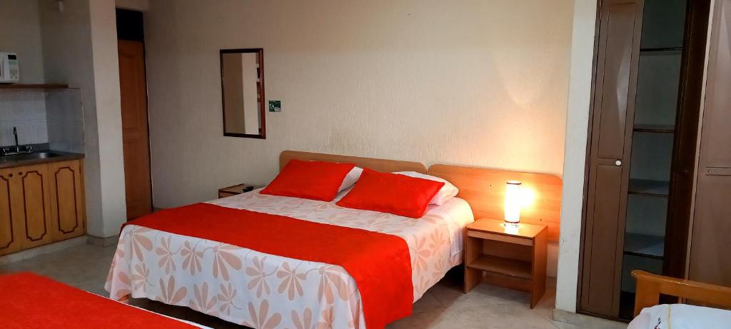 Postel nebo postele na pokoji v ubytování Hoteles Bogotá Inn Turisticas 63