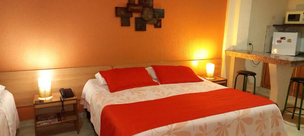 Postel nebo postele na pokoji v ubytování Hoteles Bogotá Inn Turisticas 63