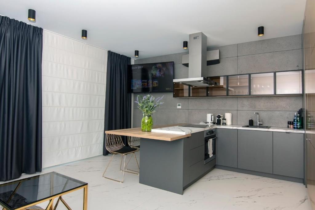 Kuchyň nebo kuchyňský kout v ubytování EL Apartments - Aries