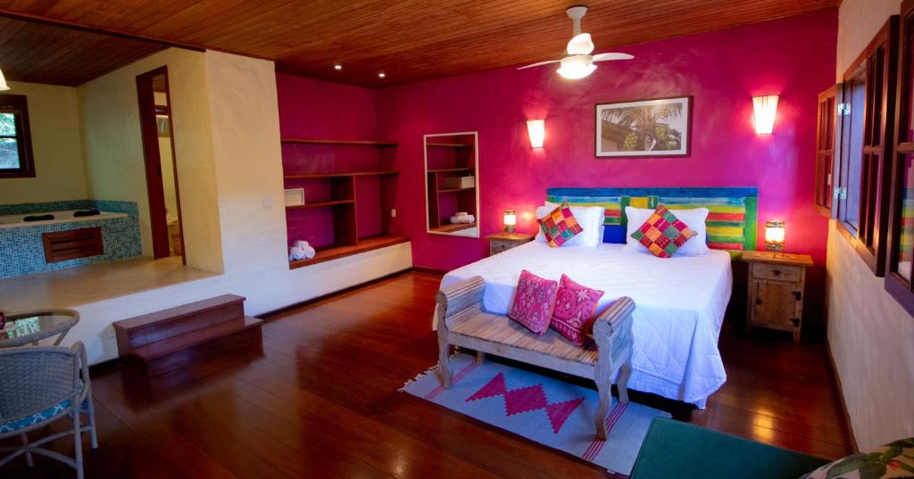 Uma cama ou camas num quarto em Atmosphera Pousada