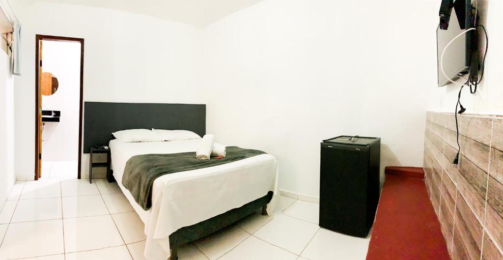 Een bed of bedden in een kamer bij Pousada Ô de Casa