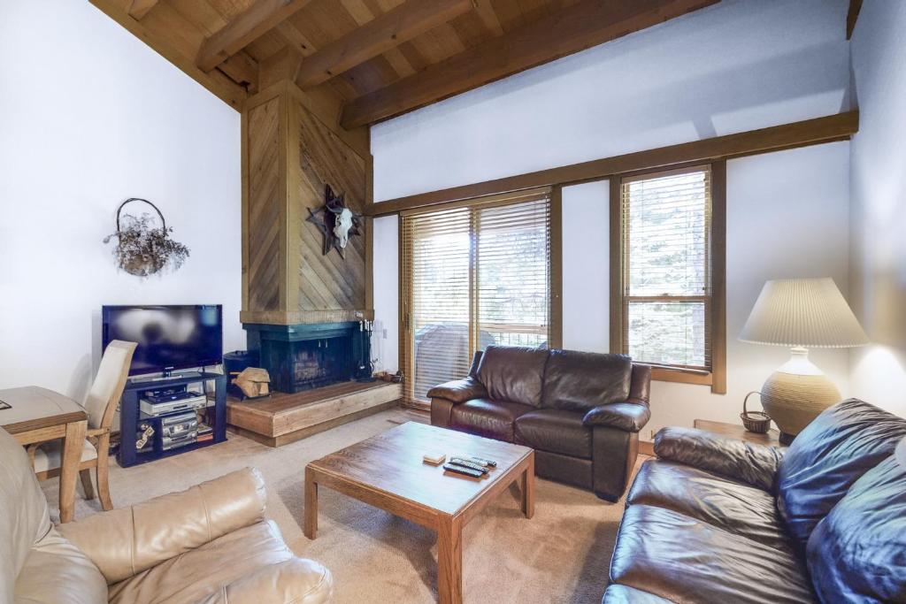 a living room with a couch and a table at Northstar Gold Bend Retreat in Truckee