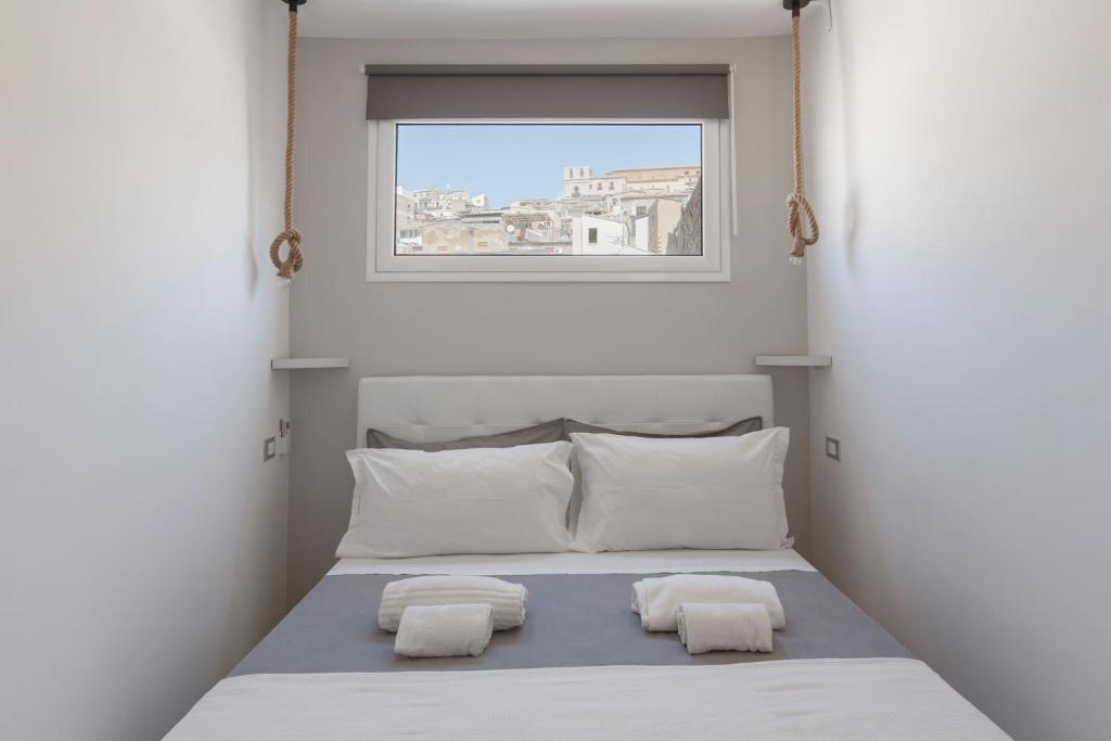 Llit o llits en una habitació de Sicily Dreams Luxury
