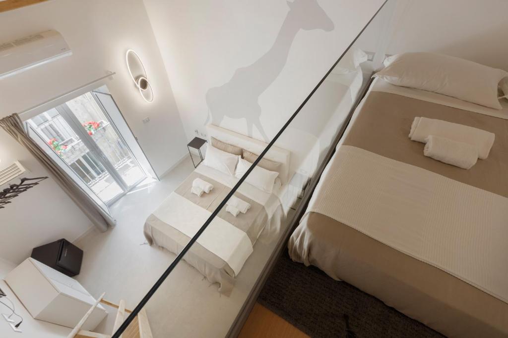 Llit o llits en una habitació de Sicily Dreams Luxury