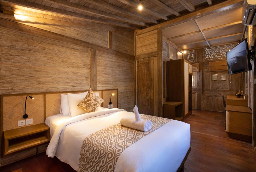 Postel nebo postele na pokoji v ubytování Saba Villa by Sanga Sanga Hospitality