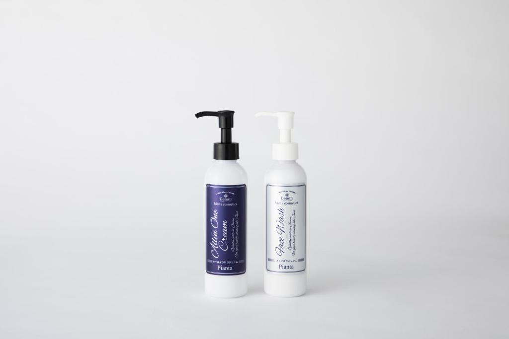 two bottles of hair products on a white background at TUBE Sq in Tokoname