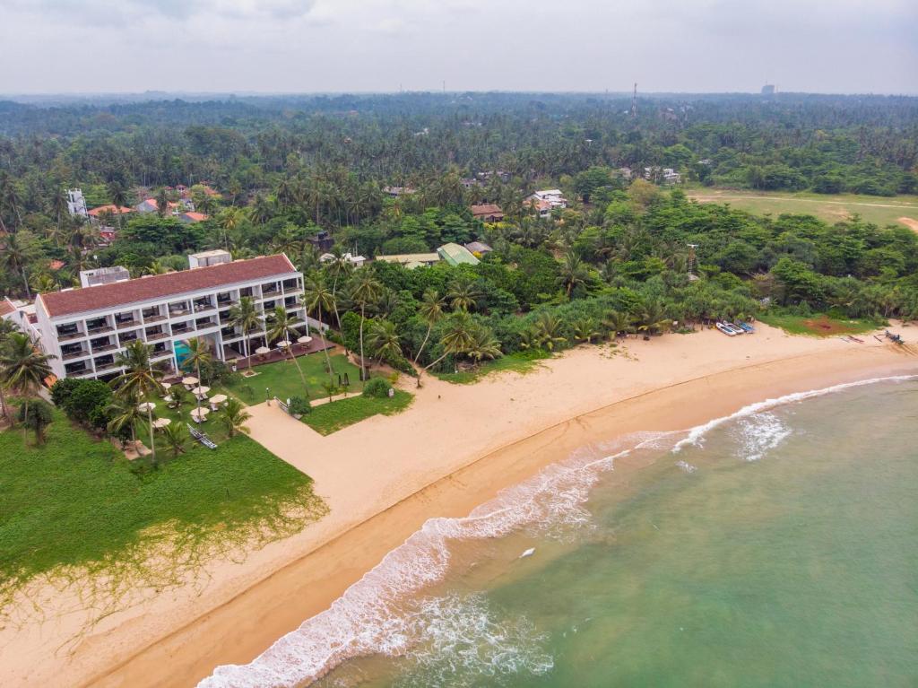 an aerial view of a hotel on the beach at Shinagawa Beach in Balapitiya