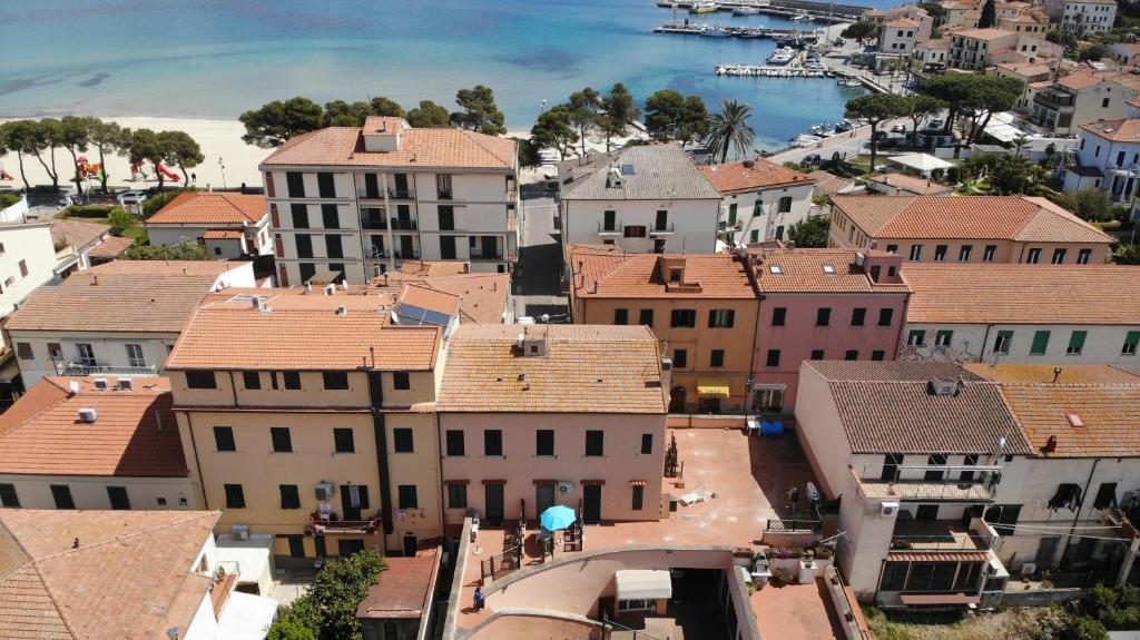 an aerial view of a town with buildings at Bilocali ALTAMAREA - zona mare con clima e terrazze in Marina di Campo